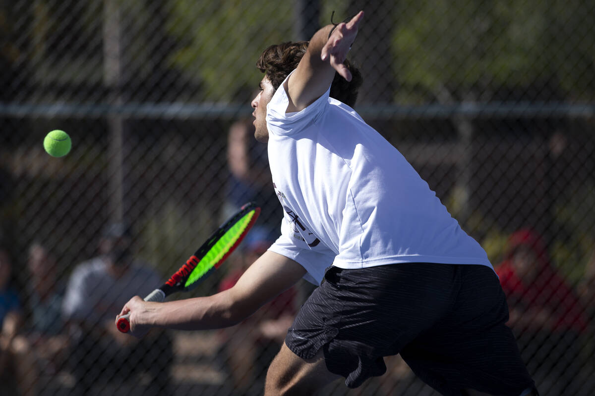 Faith Lutheran's Stephen Dobrev hits to Reno during a boys doubles class 5A championship match ...