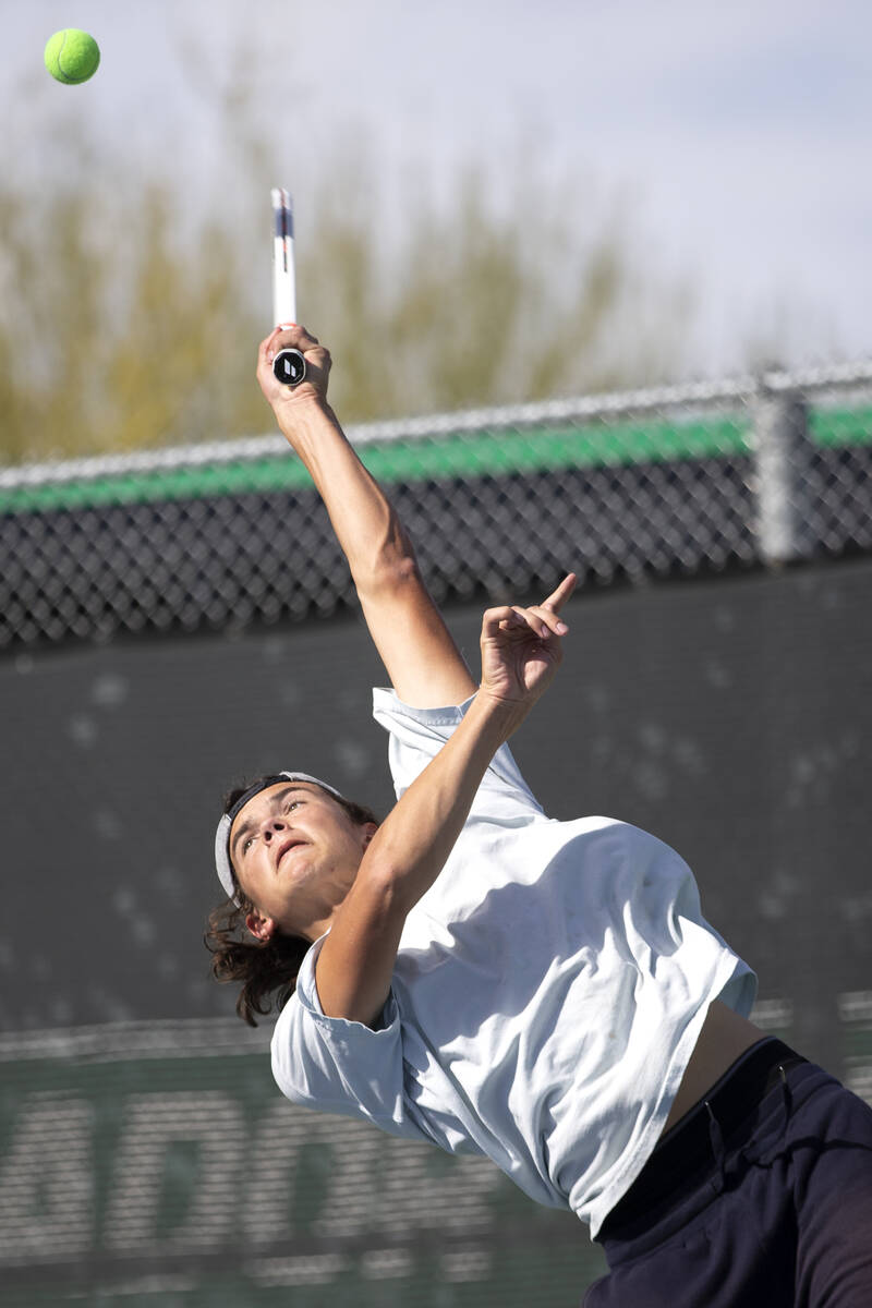Reno's Brody Friedman hits to Faith Lutheran during a boys doubles class 5A championship match ...