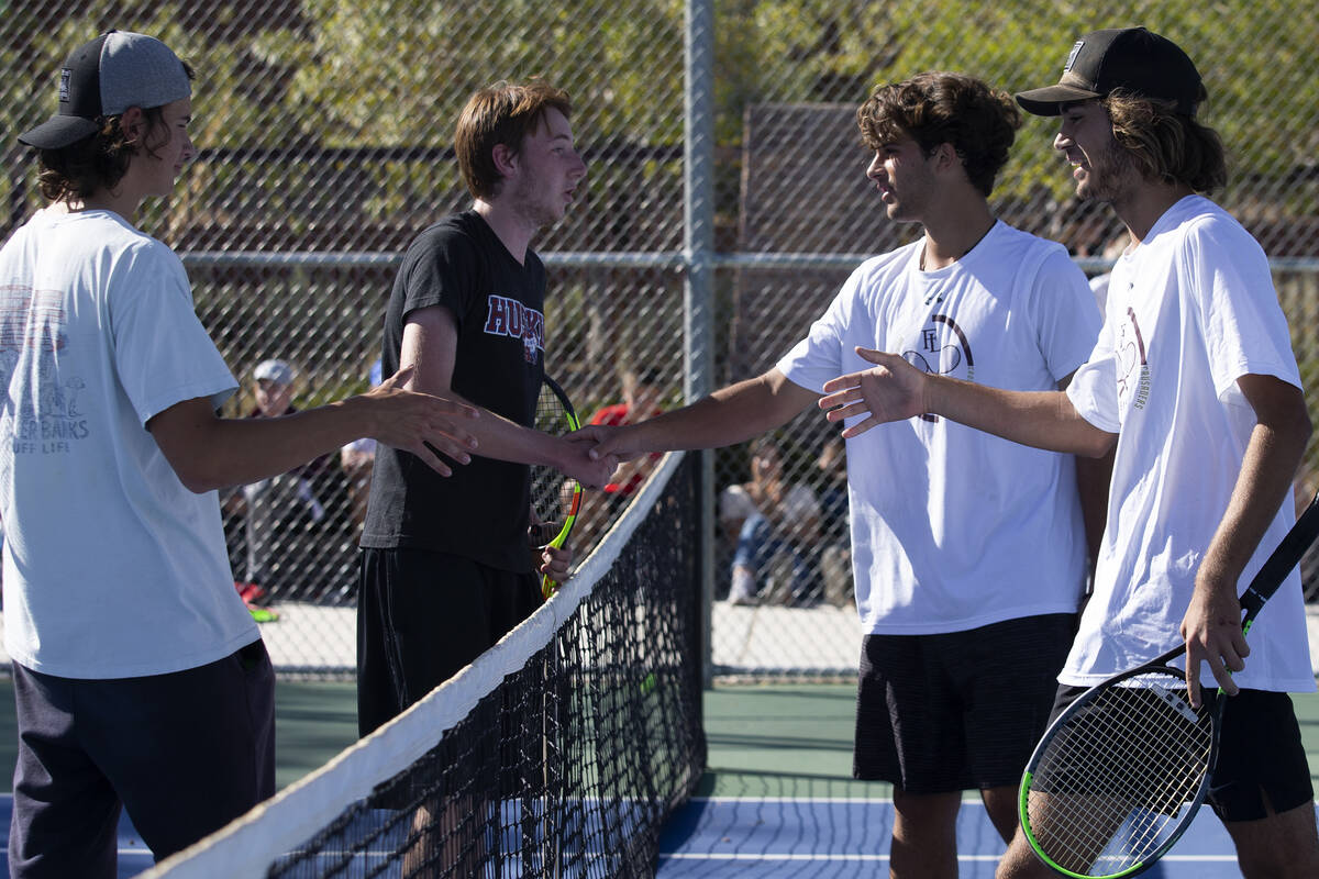 Reno's Brody Friedman, left, and Jeffrey Rinehart, second from left, congratulate Faith Luthera ...