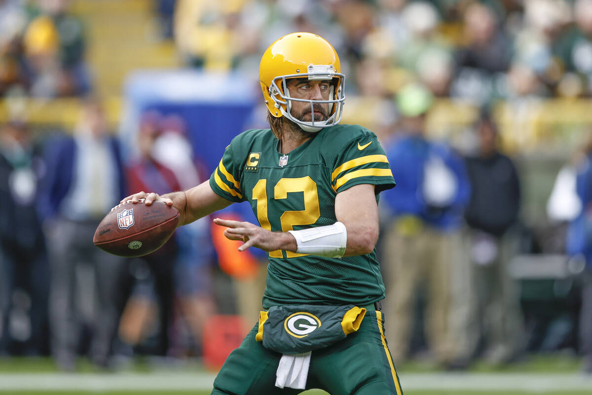 Green Bay Packers quarterback Aaron Rodgers (12) looks to pass the ball against the Washington ...
