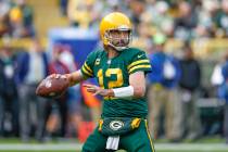 Green Bay Packers quarterback Aaron Rodgers (12) looks to pass the ball against the Washington ...