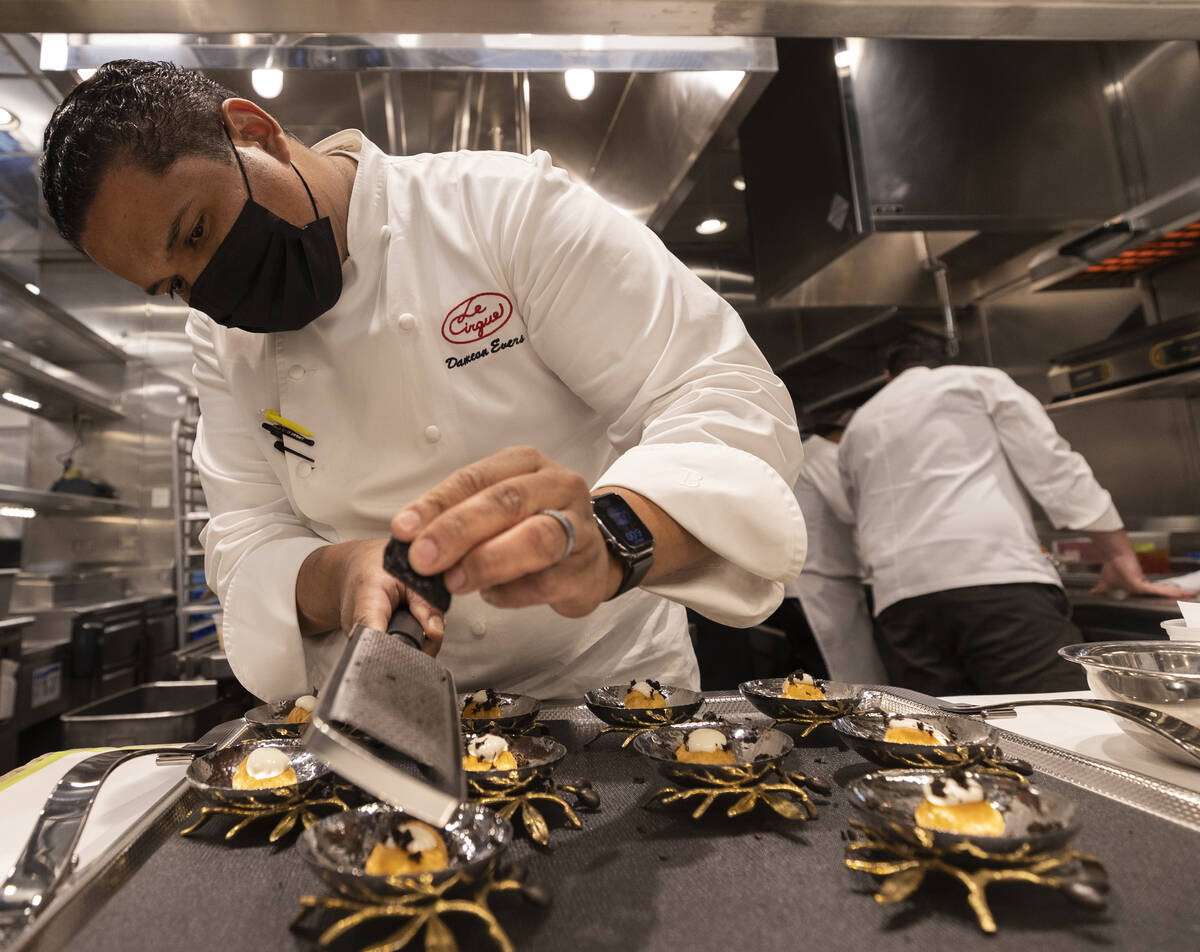 Executive Chef Dameon Evers prepares gougere with black winter truffle fondue at Le Cirque on