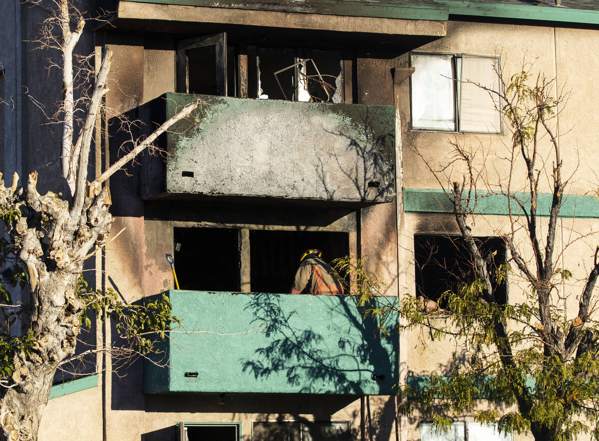 A Las Vegas firefighter investigates the cause of a fire that damaged the Arthur McCants Manor ...