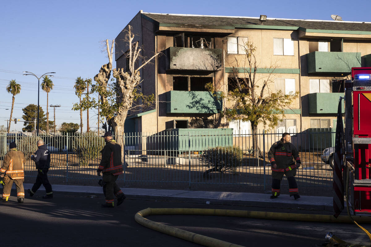 Las Vegas firefighters investigate the cause of a fire that damaged the Arthur McCants Manor ap ...