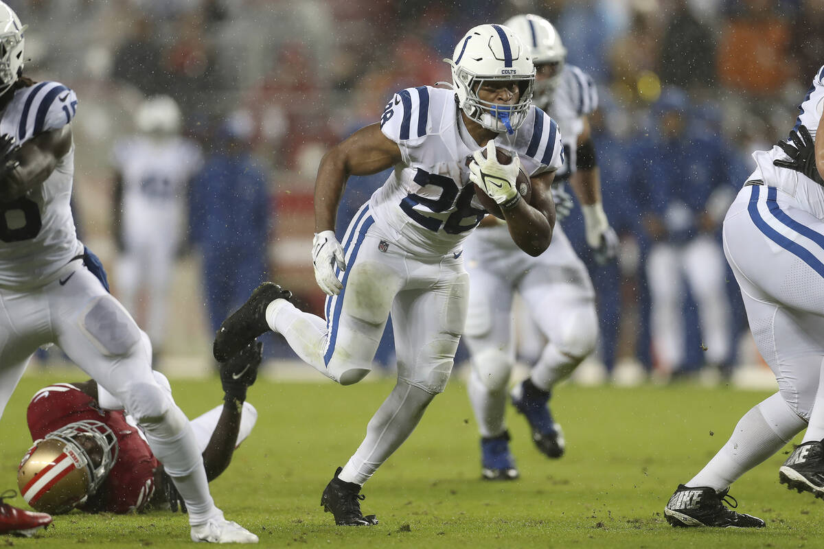 Indianapolis Colts running back Jonathan Taylor (28) runs against the San Francisco 49ers durin ...