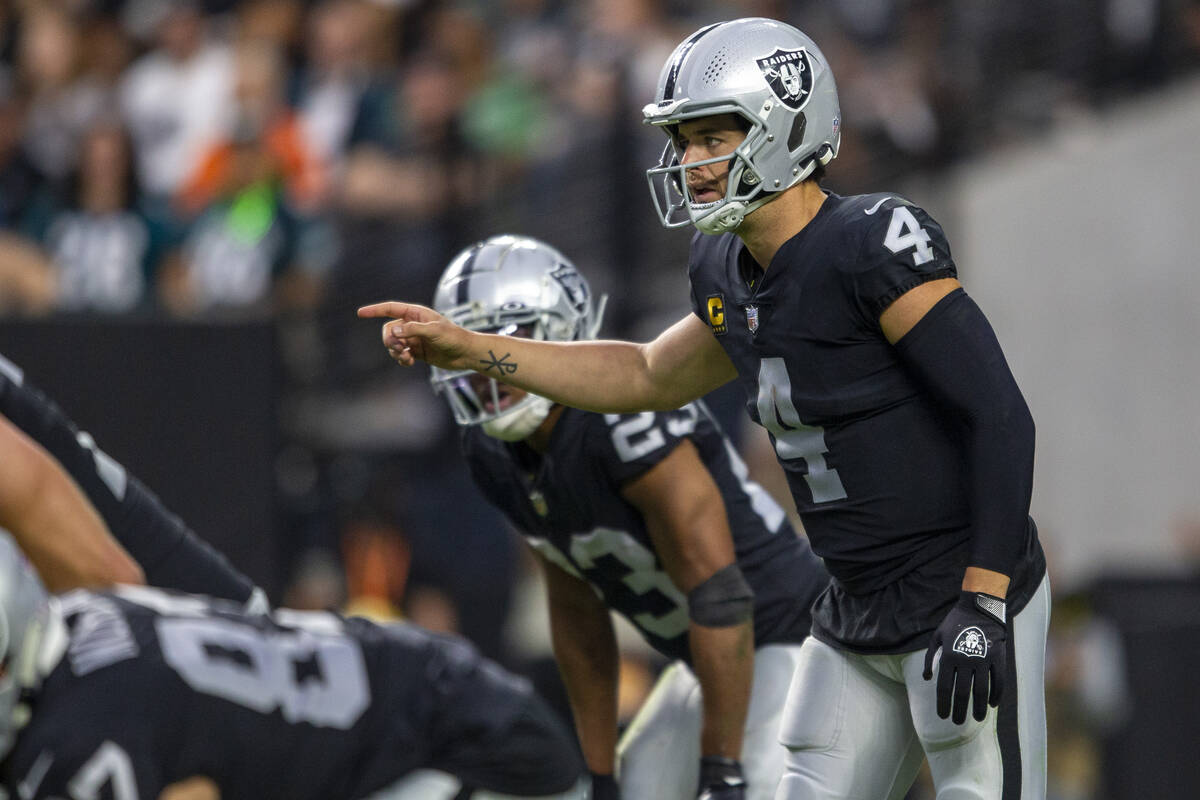 Raiders quarterback Derek Carr (4) audibles at the line of scrimmage during the third quarter o ...