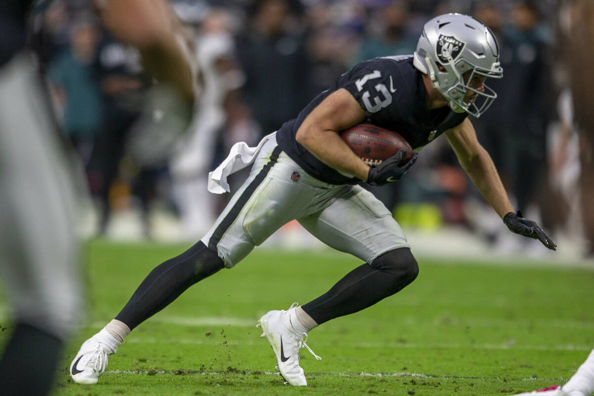 Raiders wide receiver Hunter Renfrow (13) looks for room to run during the third quarter of an ...