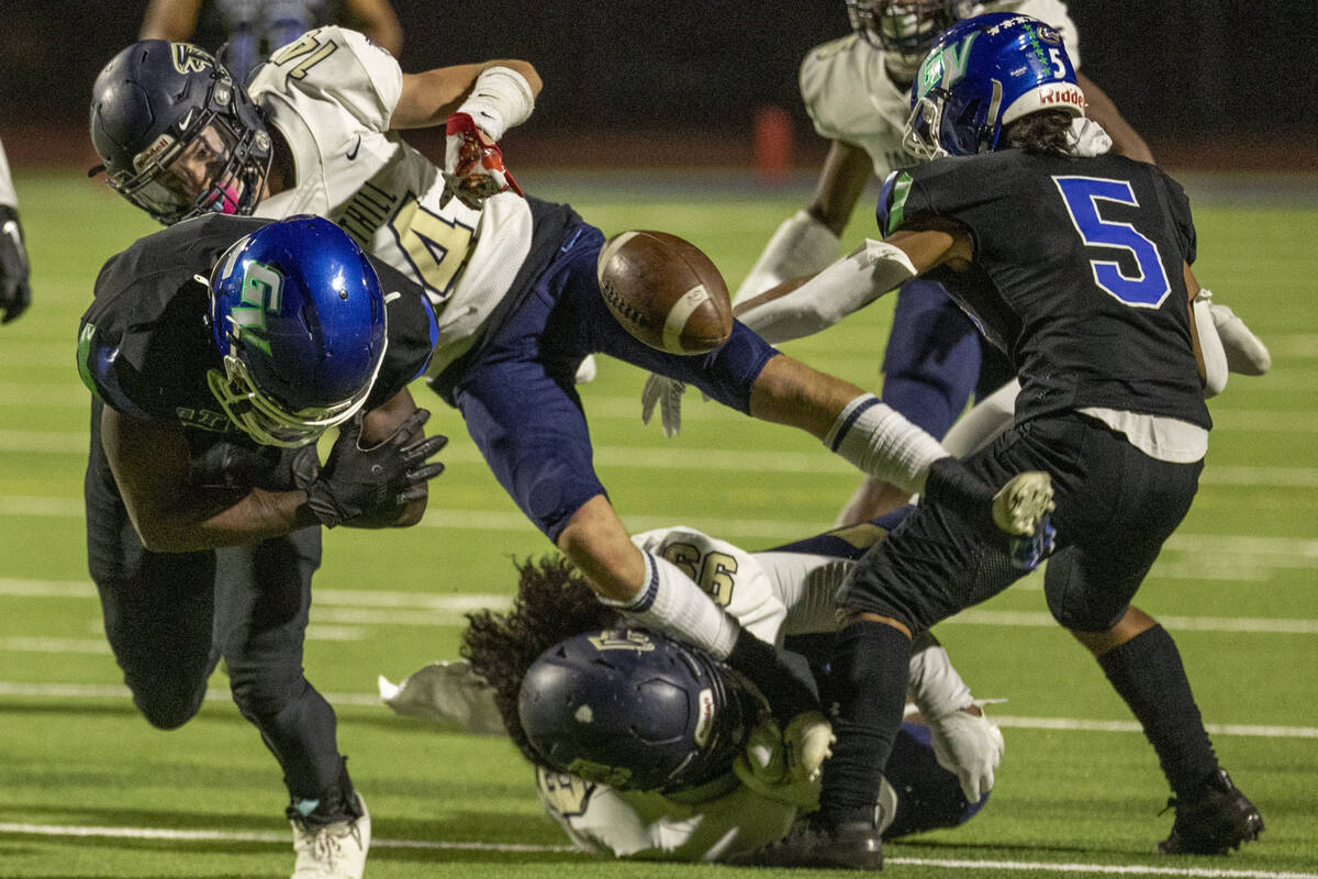 Green Valley running back Jaylen Mcknight (6) has the ball stripped for a fumble by Foothill sa ...