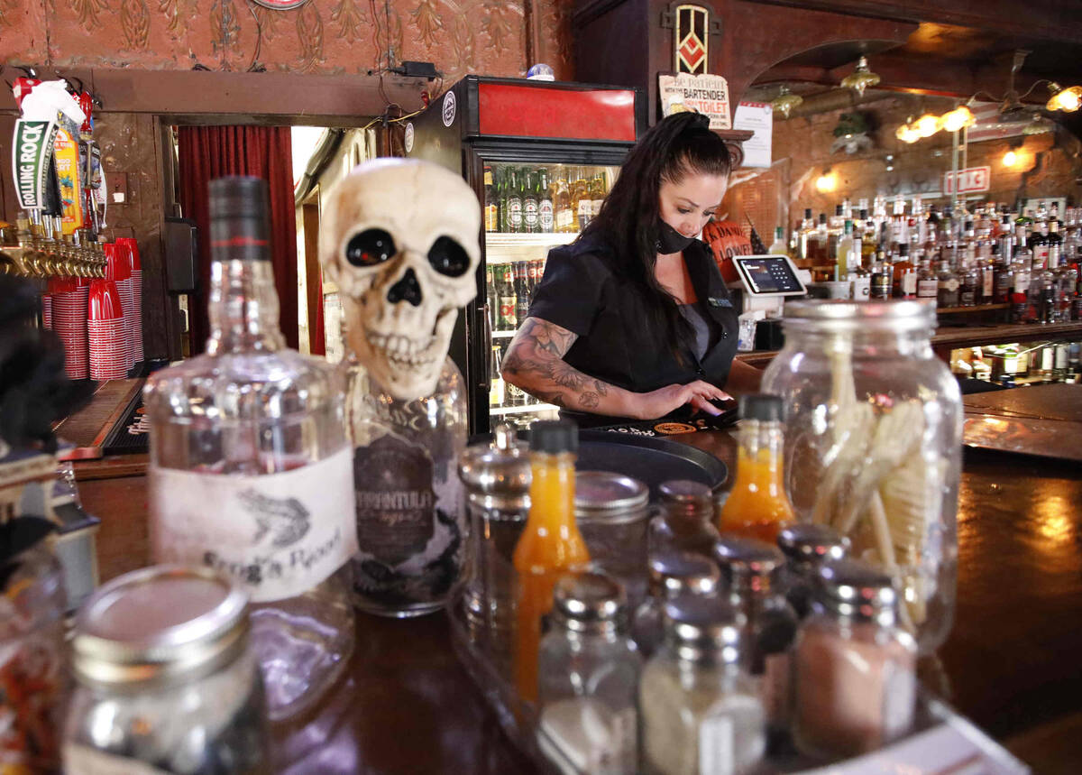 Bartender Traci Ealy works in the Pioneer Saloon, Thursday, Oct. 28, 2021, in Goodsprings, Nev. ...