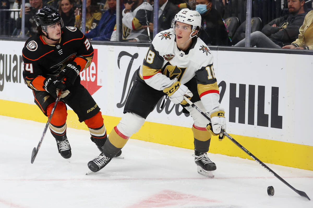 Vegas Golden Knights center Peyton Krebs (18) looks for an open pass under pressure from Anahei ...