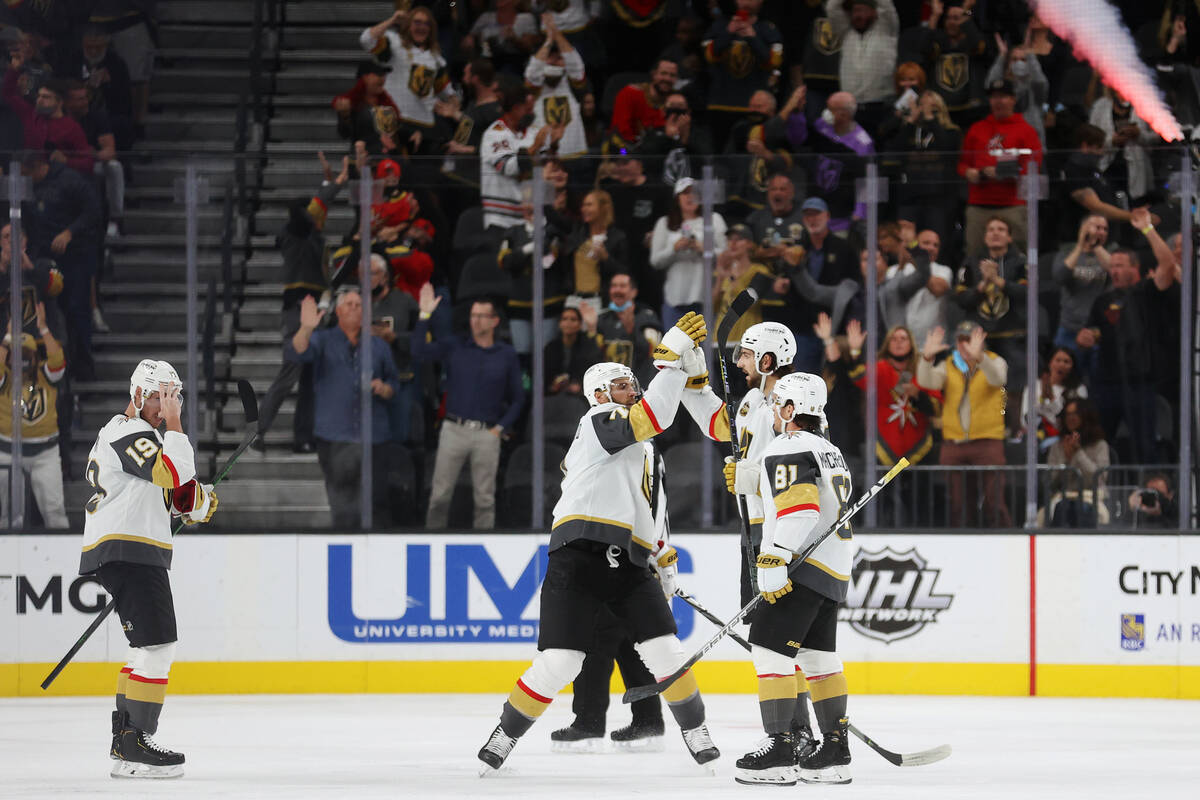 Vegas Golden Knights defenseman Nicolas Hague (14) celebrates his goal with teammates in the se ...