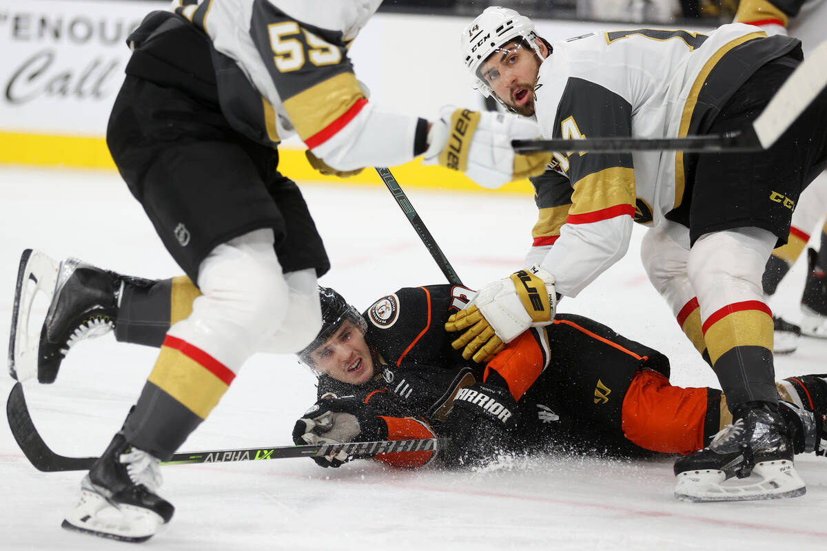 Vegas Golden Knights defenseman Nicolas Hague (14) takes down Anaheim Ducks right wing Troy Ter ...