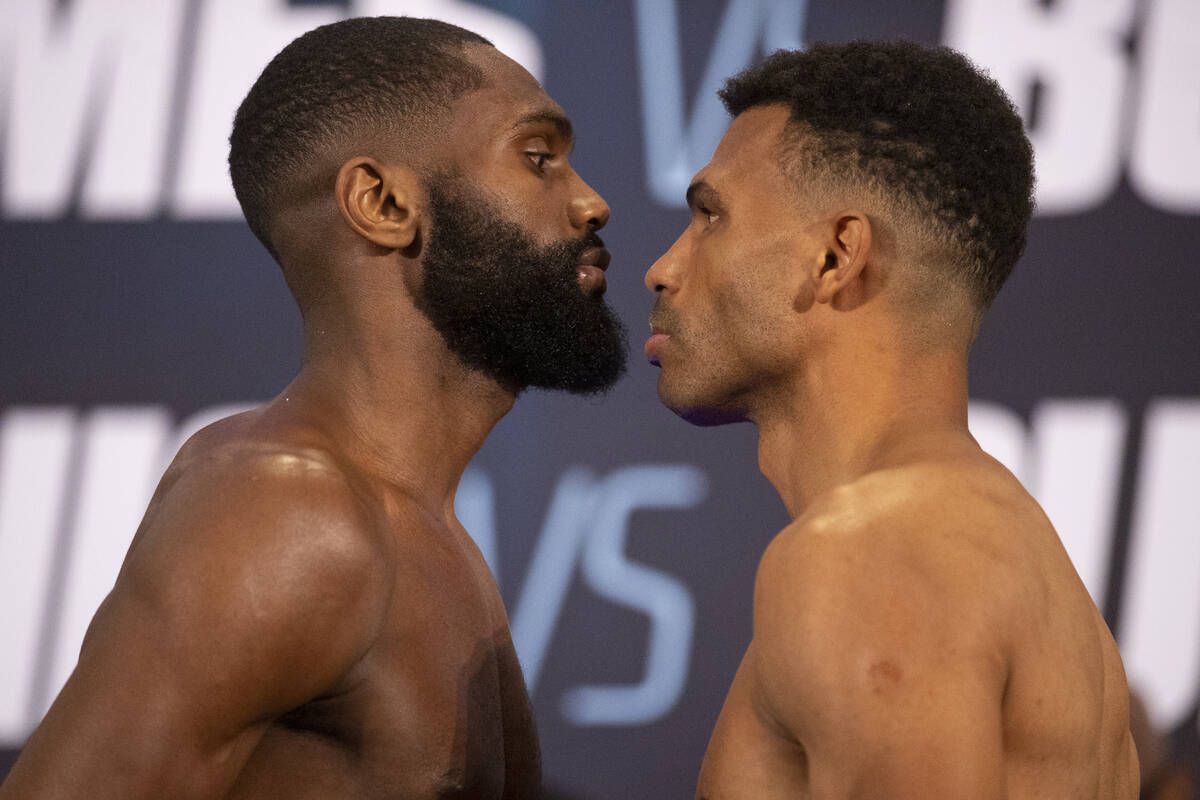 Jaron Ennis, left, and Thomas Dulorme, face off during their weigh in at the Michelob Ultra Are ...