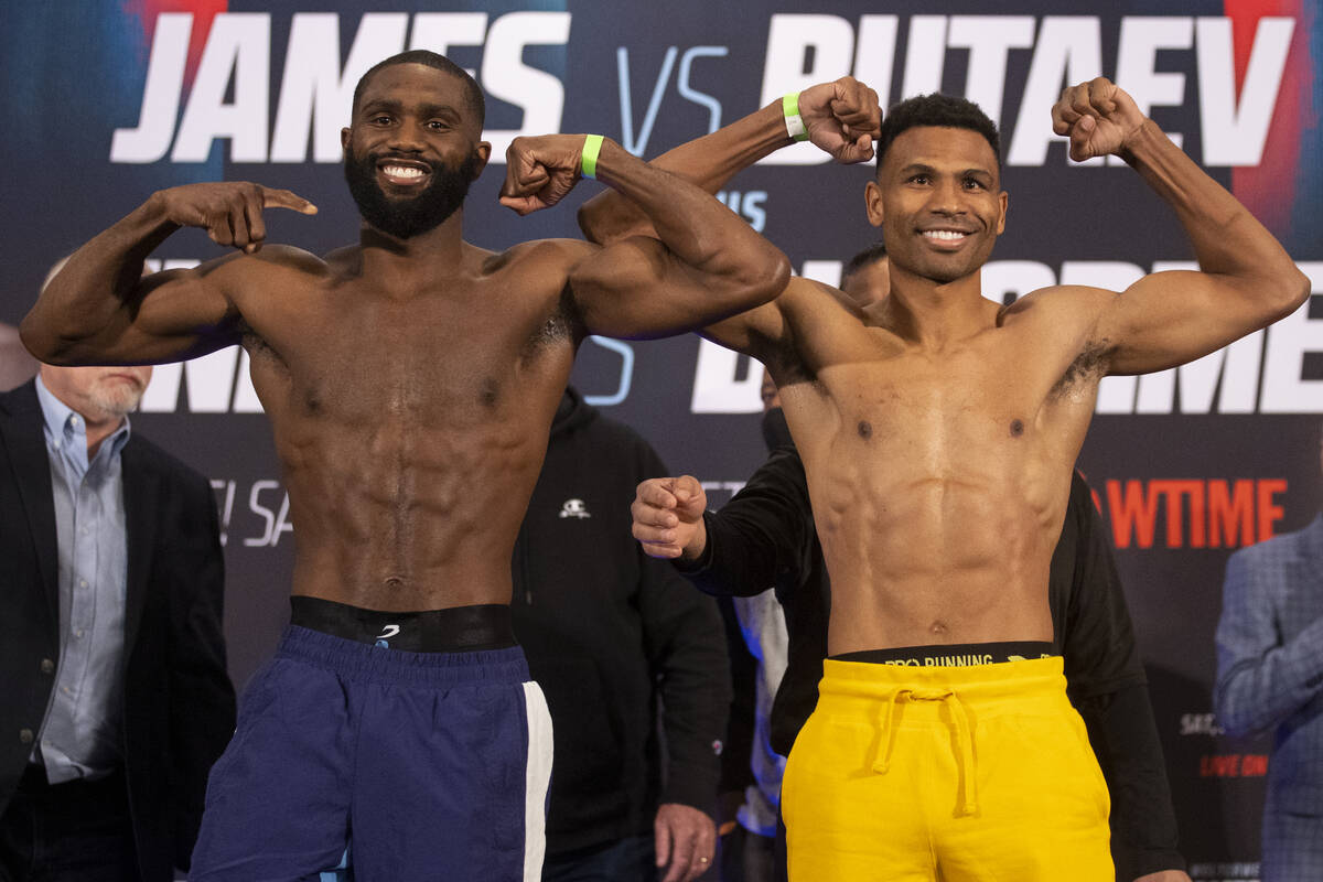 Jaron Ennis, left, and Thomas Dulorme, pose during their weigh in at the Michelob Ultra Arena i ...