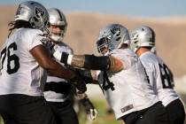 Raiders offensive guard Richie Incognito (64) blocks Raiders offensive guard John Simpson (76) ...