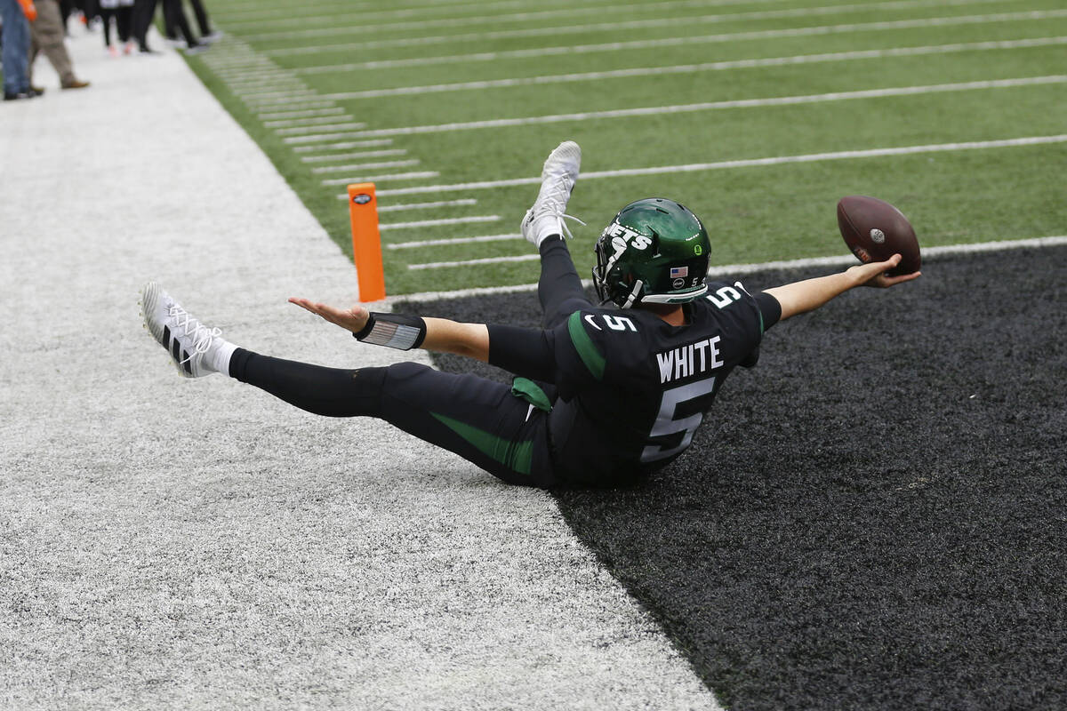 New York Jets quarterback Mike White celebrates after catching a two-point conversion during th ...