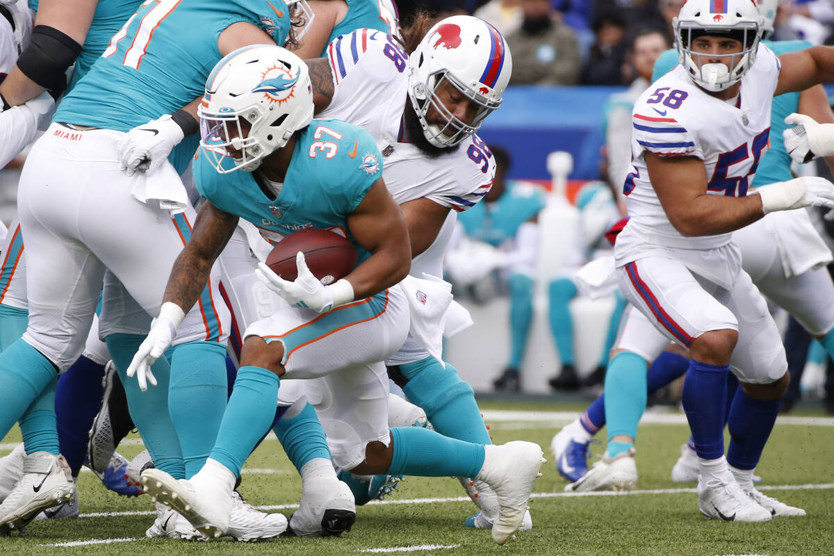 Miami Dolphins running back Myles Gaskin (37) runs against the Buffalo Billsduring the first ha ...