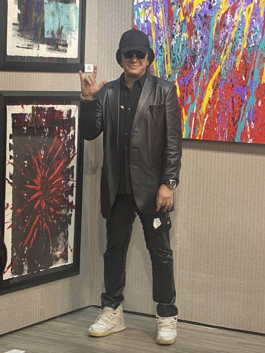 Gene Simmons of Kiss is shown amid his exhibit of original paintings at The Grand Canal Shoppes ...
