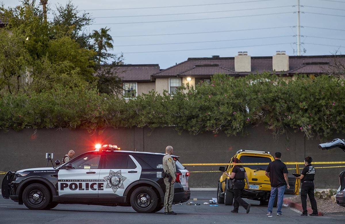 Metro officers and crime scene investigators conduct a homicide investigation at the Solaire Ea ...