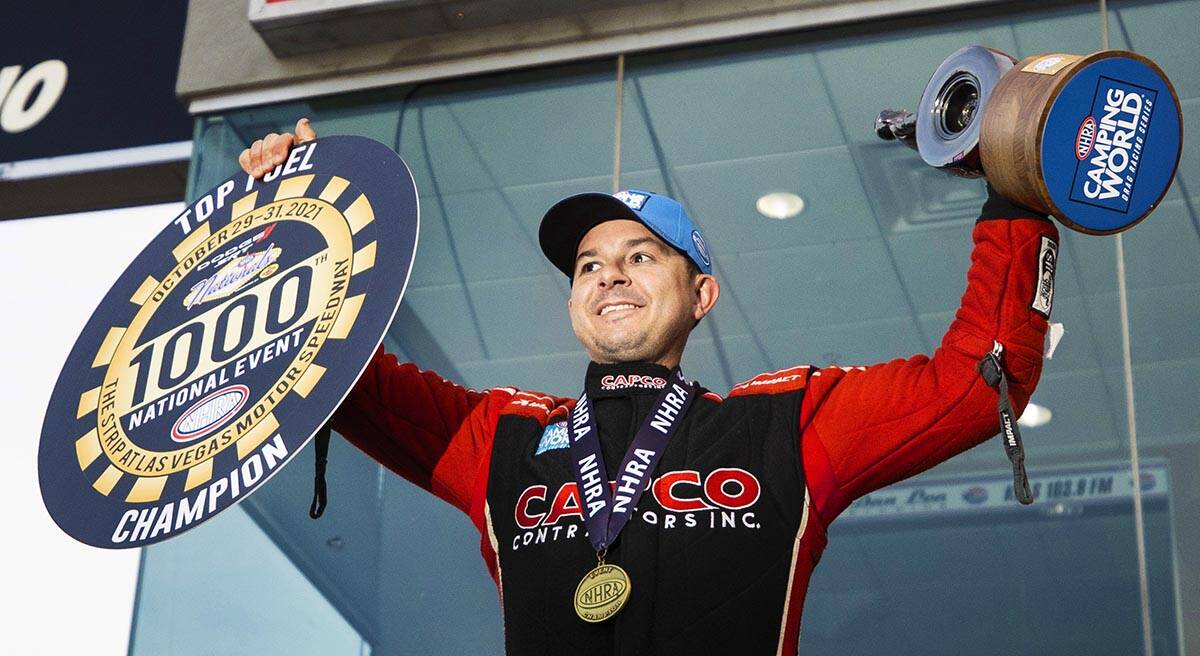 Steve Torrence celebrates after winning the Top Fuel division during the Dodge//SRT NHRA Natio ...