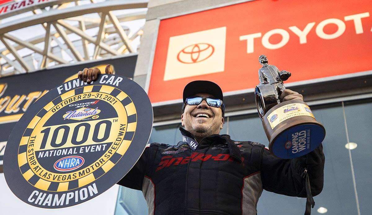 Cruz Pedregon celebrates after winning the Funny Car division during the Dodge//SRT NHRA Nation ...