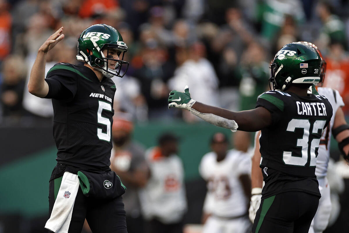 New York Jets quarterback Mike White (5) reacts after defeating the Cincinnati Bengals in an NF ...
