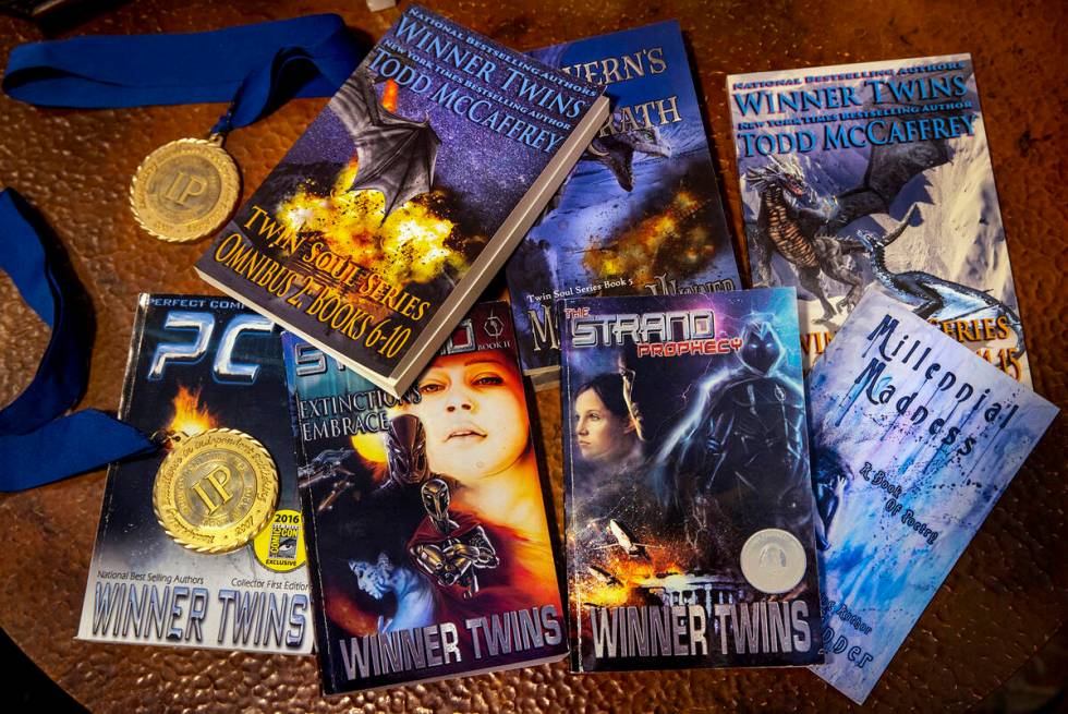 Books and a few literary awards by Brittany and Brianna Winner, a pair of successful sci-fi aut ...