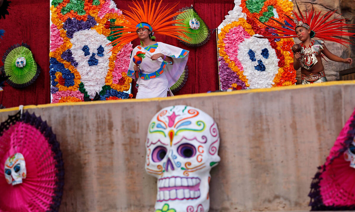 Dance troupe Xochipilli members Carolina Mendez, 15 and Gabriel Chavez, 9, perform an Aztec dan ...