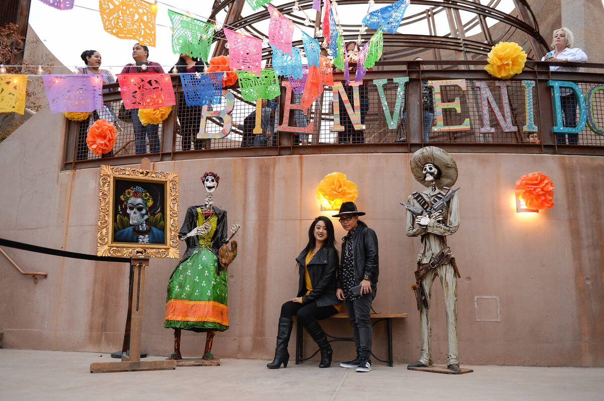 Analiese Zubiate, left, and Duwop Rose pose for a photograph at the Día de Muertos celebration ...