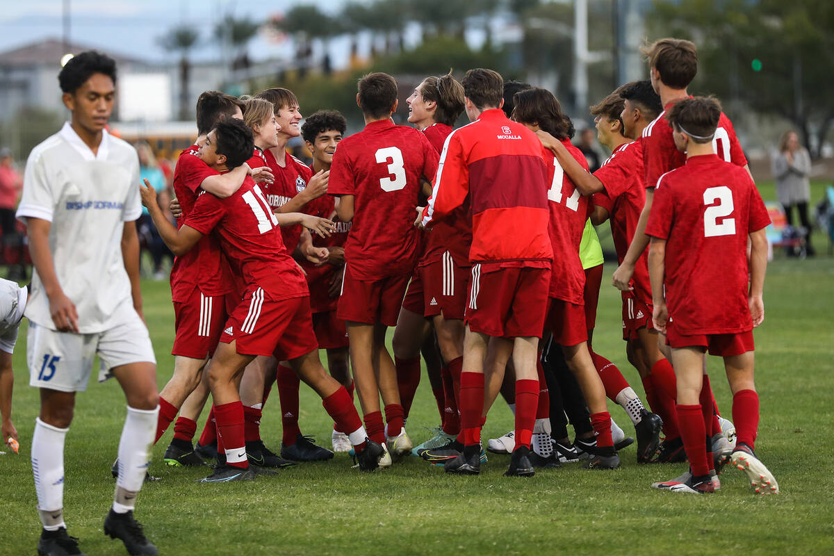 Coronado High School players cheer after winning a Class 5A boys playoff game against Bishop Go ...