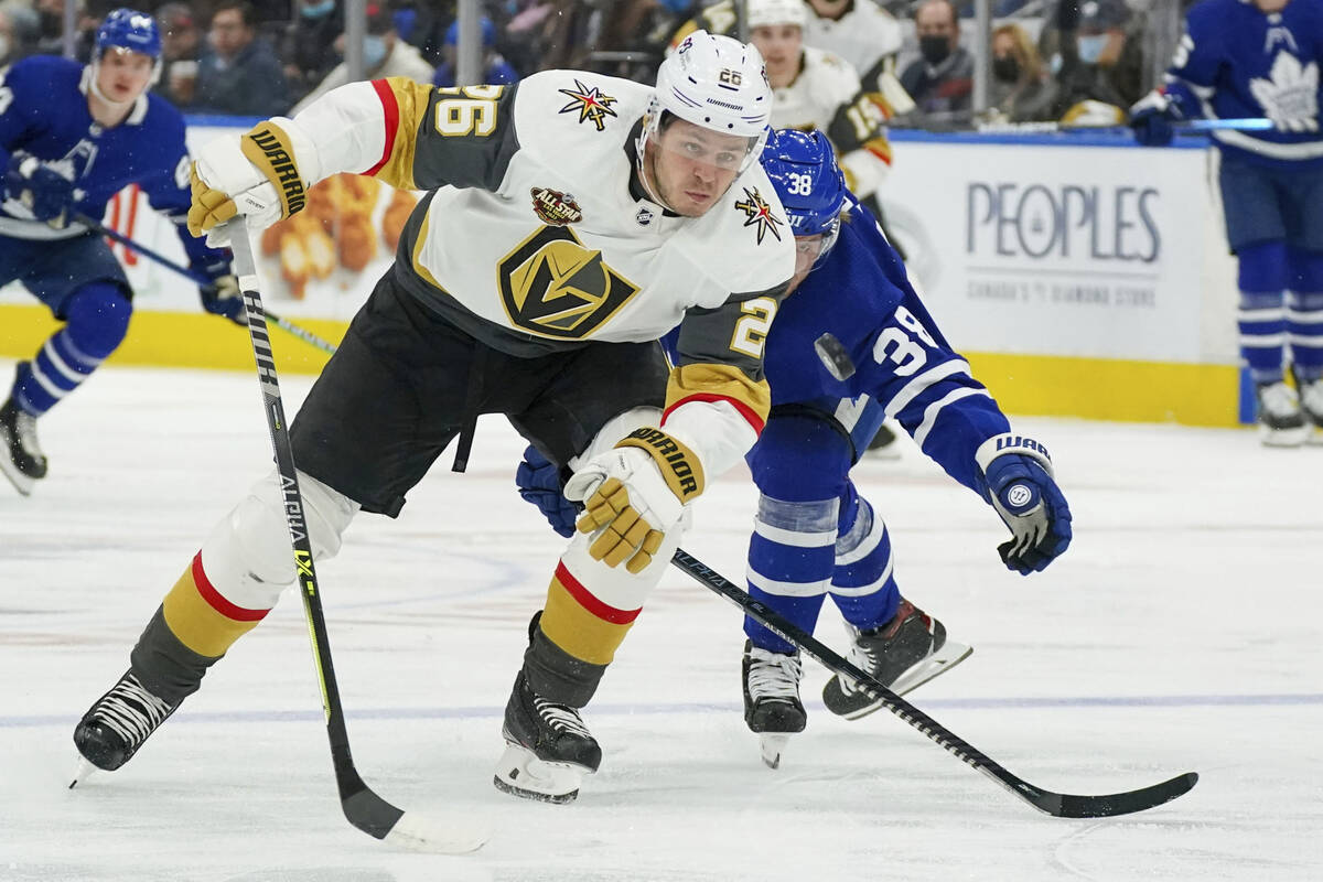 Vegas Golden Knights forward Mattias Janmark (26) chases the puck as Toronto Maple Leafs defens ...