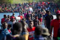 Haiti migrants waiting in Del Rio and Ciudad Acuña to get access to the United States, cro ...