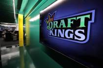 In this May 2, 2019, file photo, the DraftKings logo is displayed at the sports betting company ...