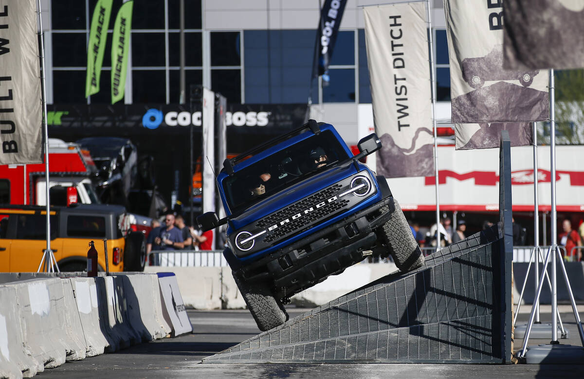 Attendees test drive a Ford Bronco during the Specialty Equipment Market Association, or SEMA, ...