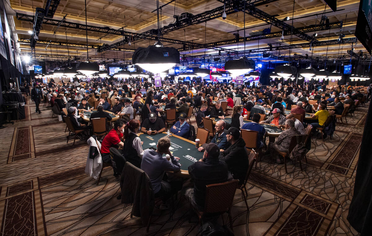 Players and dealers around the tables during Day 1A of the $10,000 buy-in Main Event at the Wor ...
