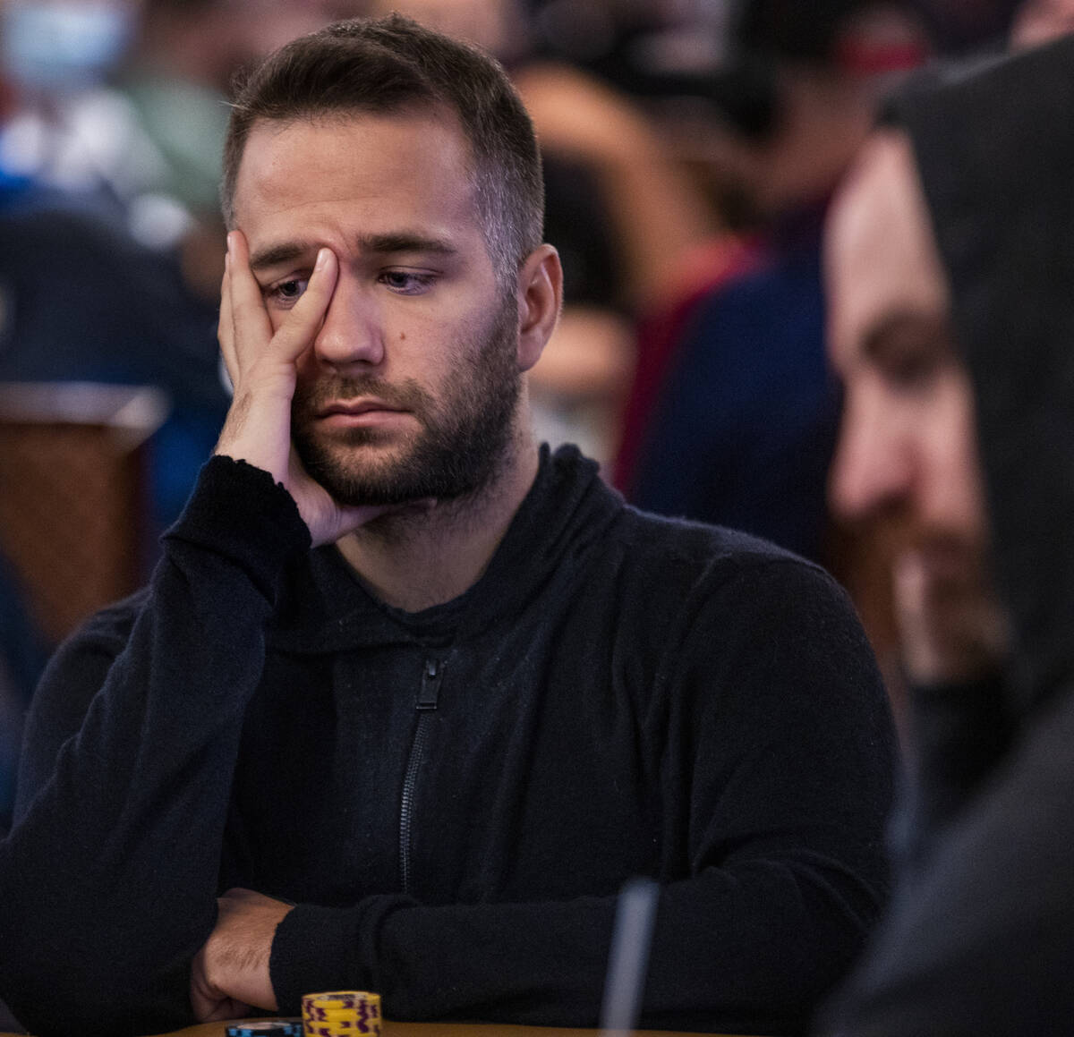 Ivan Zufic of Croatia looks on at the current play at his table during Day 1A of the $10,000 bu ...