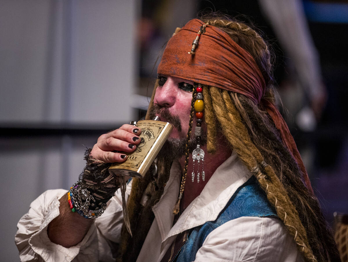 Scotter Clark from Iowa takes a sip from his flask during Day 1A of the $10,000 buy-in Main Eve ...