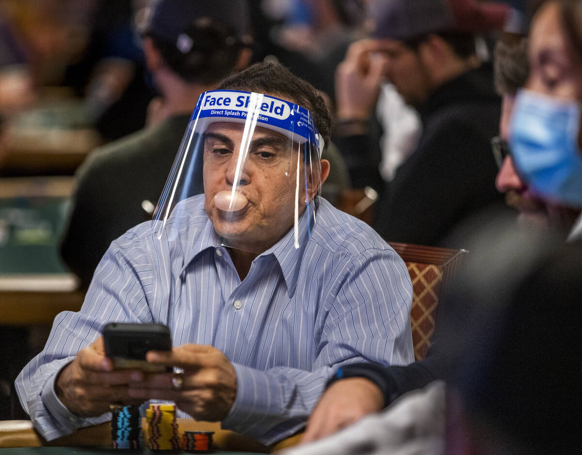 Haim Gabay of Las Vegas blows a bubble while waiting for the next round to be dealt during Day ...