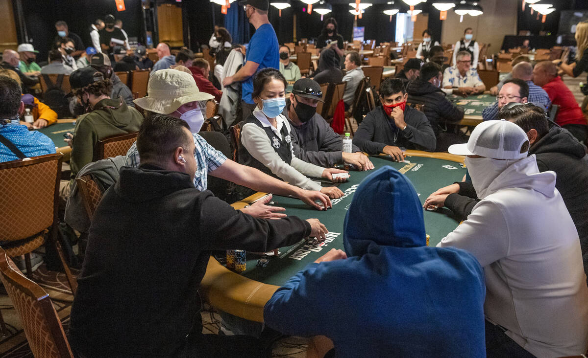Some players wear hoods, hats, masks and sunglasses during Day 1A of the $10,000 buy-in Main Ev ...