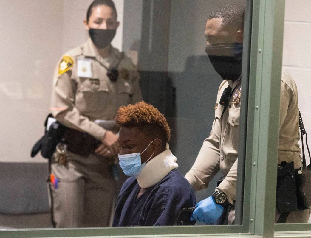 Former Raiders wide receiver Henry Ruggs, accused of DUI resulting in death, is led into the co ...