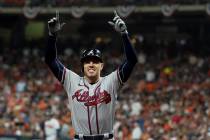 Atlanta Braves' Freddie Freeman celebrates his home run during the seventh inning in Game 6 of ...