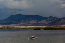 A fisherman uses a kayak in the Adams-McGill reservoir at the Wayne E. Kirch Wildlife Managemen ...