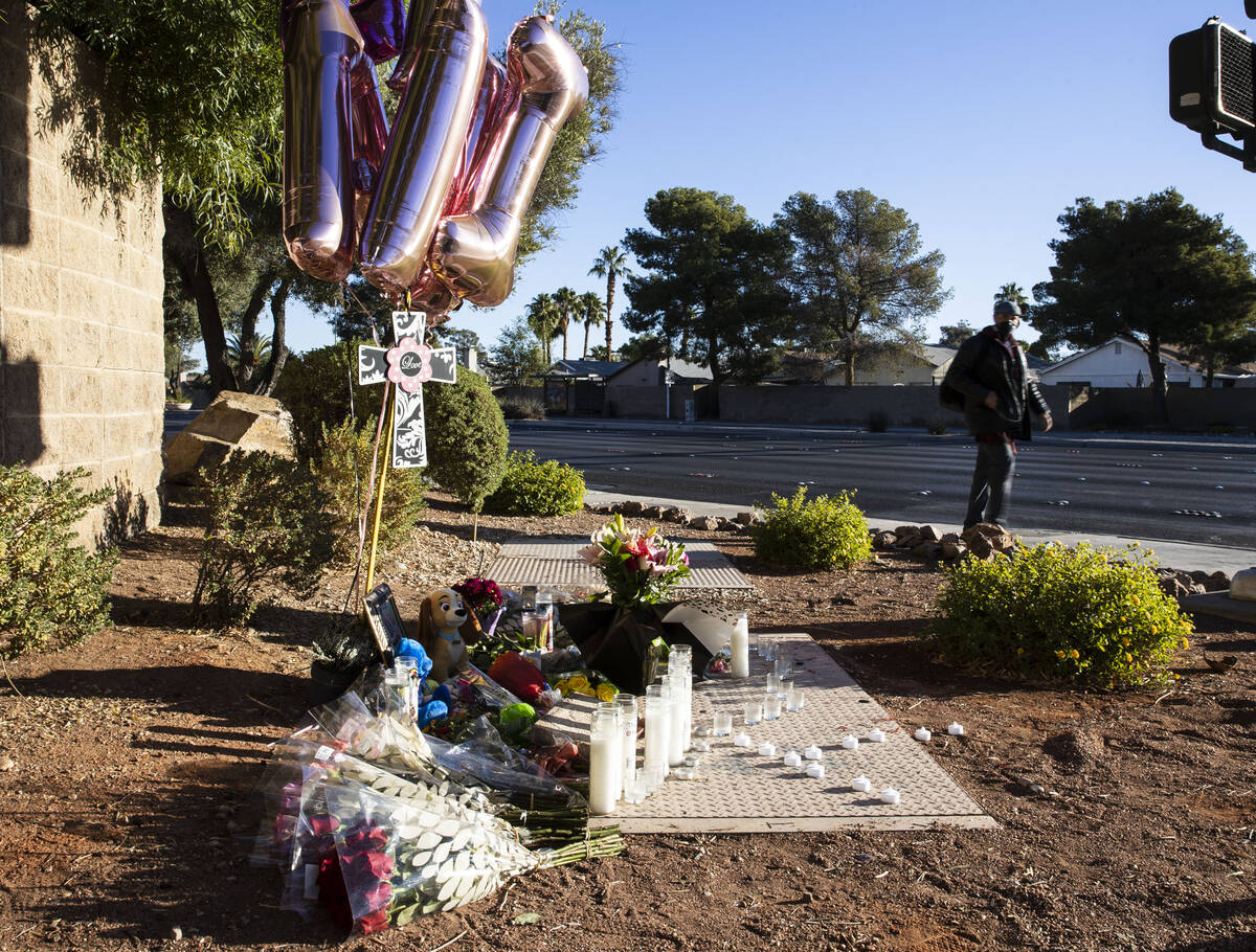 A makeshift memorial to honor Tina Tintor, 23, is seen at South Rainbow Boulevard and Spring Va ...