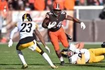 Cleveland Browns running back Nick Chubb (24) breaks away from a tackle by Pittsburgh Steelers ...
