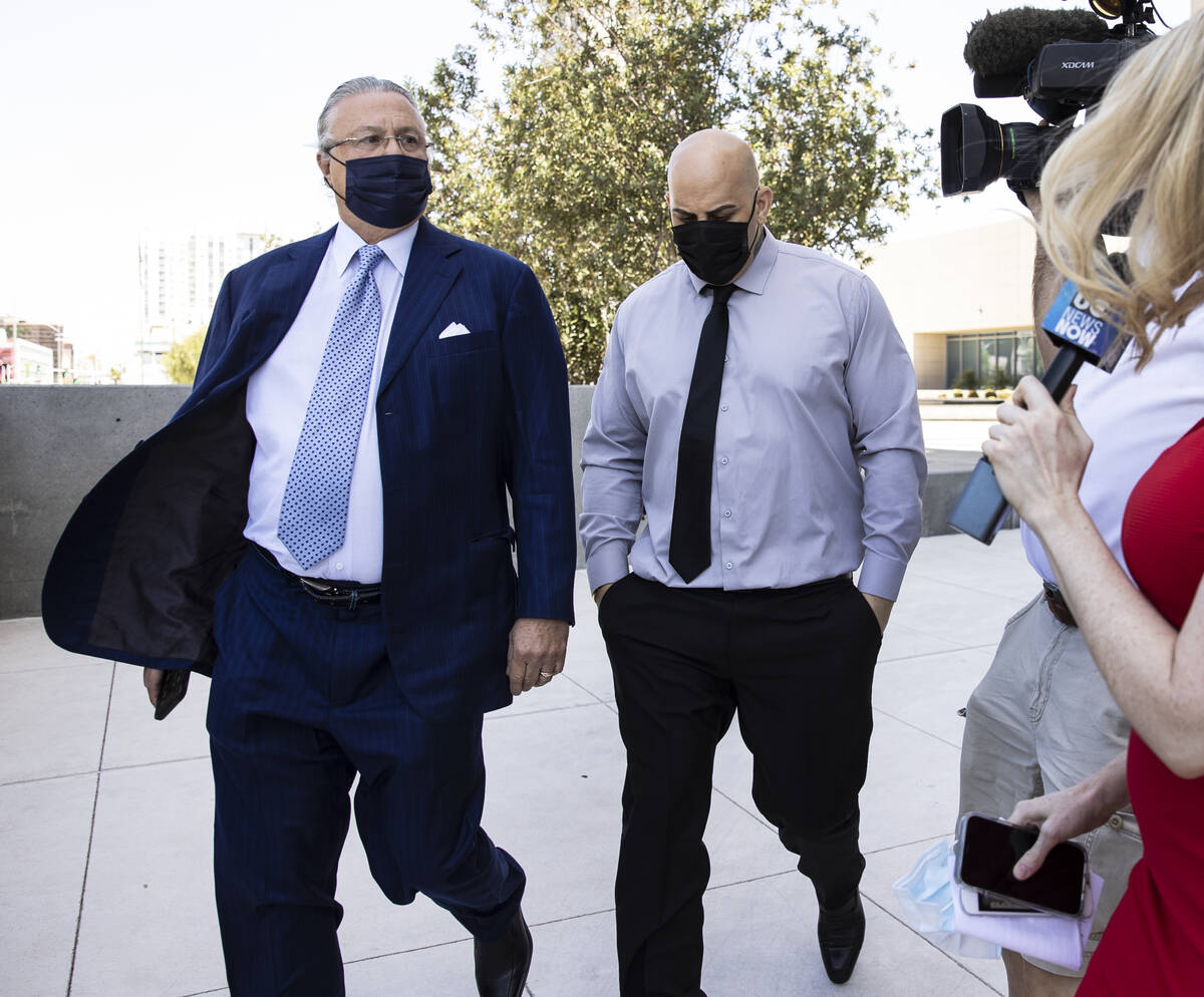 Hip-hop producer known as Mally Mall, center, leaves the Lloyd D. George Federal Courthouse wit ...