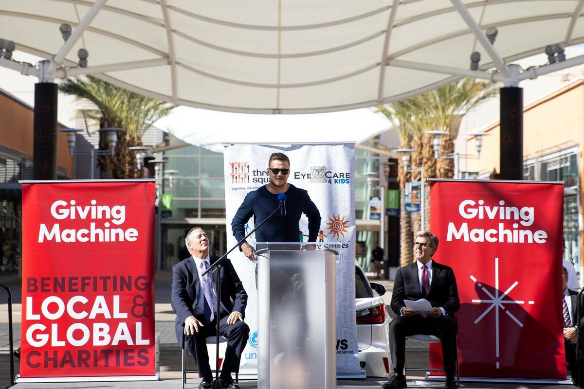 Dan Reynolds of Imagine Dragons speaks during a launch event for the "giving machine," a vendin ...