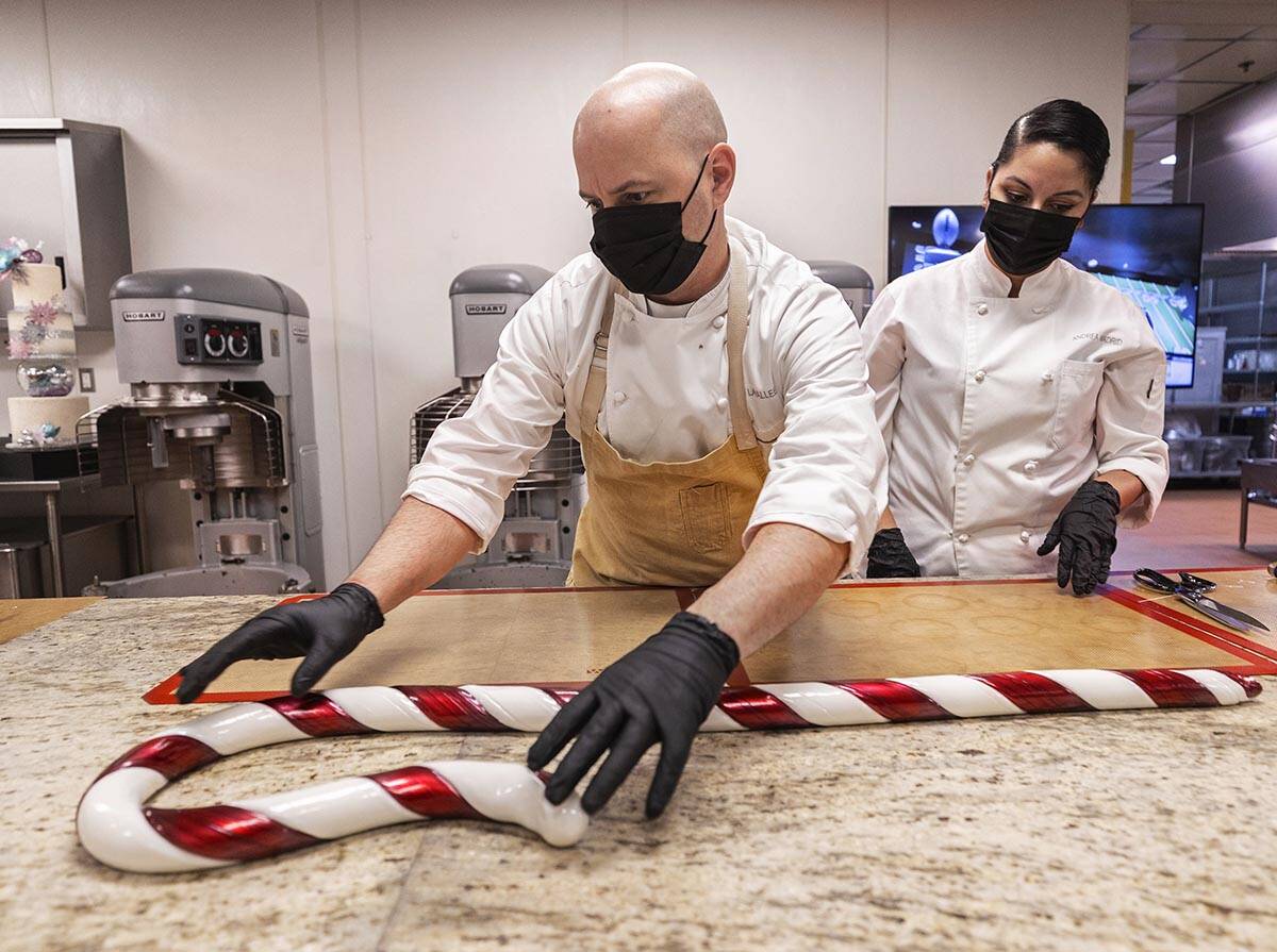 Executive pastry chef Mathieu Lavallee, left, and assistant pastry chef Andrea Madrid shape a g ...