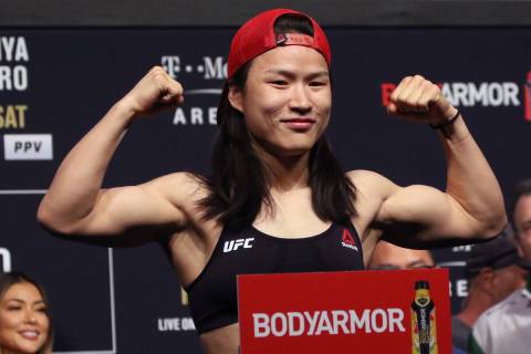 UFC strawweight champion Zhang Weili poses on the scale during the UFC 248 ceremonial weigh-ins ...
