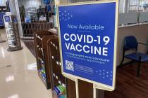 In this Saturday, Oct. 23, 2021, photograph, a sign notifies customers that COVID-19 vaccinatio ...