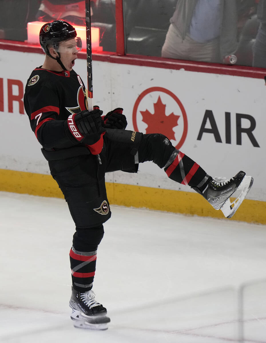 Brady Tkachuk of the Ottawa Senators pulls out a belt celebration